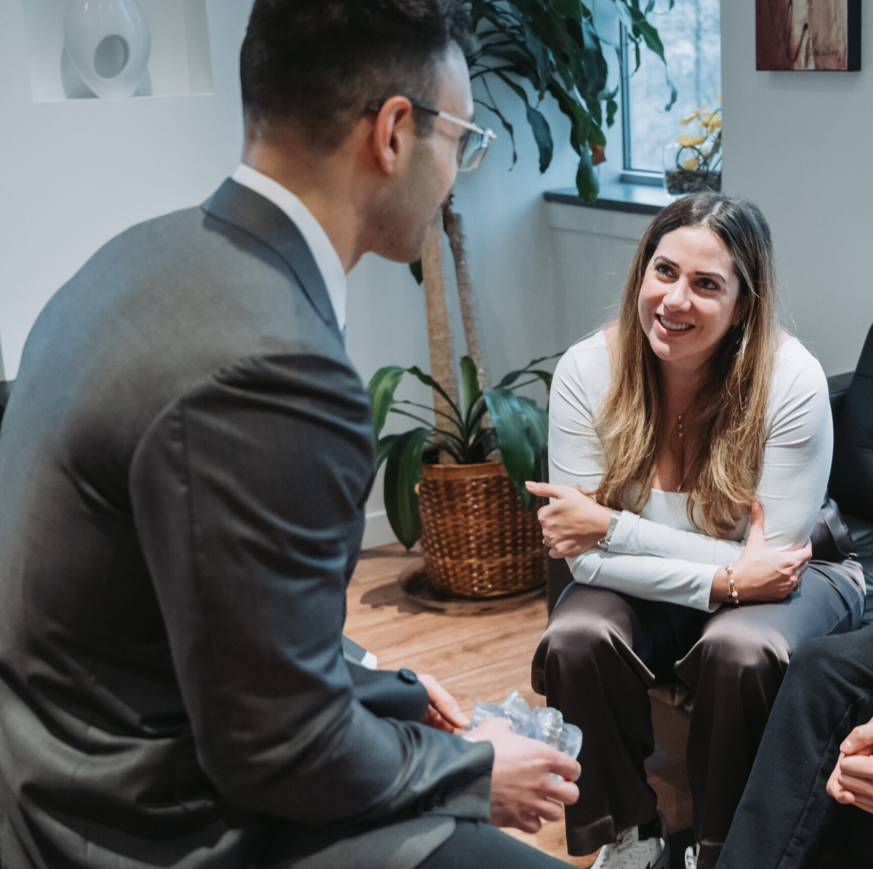 Dental implant specialist and satisfied patient discuss implants, emphasizing the importance of preparation for lasting success. 